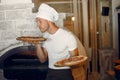 Chef in a white uniform prepare a pizzaa Royalty Free Stock Photo