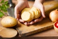 Chef prepare potatoes on chopping board for cook a potato salad at kitchen