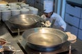 Chef prepare to cook oil in wok at commercial kitchen