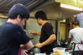 Chef prepares Asian food in the kitchen