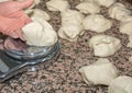 The chef prepares the balls of pizza dough on the floured table.Food, italian cuisine and cooking concept. Preparation of the Ital Royalty Free Stock Photo