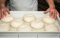 The chef prepares the balls of pizza dough on the floured table.Food, italian cuisine and cooking concept. Preparation of the Ital Royalty Free Stock Photo