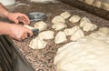 The chef prepares the balls of pizza dough on the floured table.Food, italian cuisine and cooking concept. Preparation of the Ital Royalty Free Stock Photo