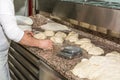 The chef prepares the balls of pizza dough on the floured table.Food, italian cuisine and cooking concept. Preparation of the Ital Royalty Free Stock Photo