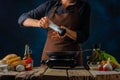 The chef prepares a Caesar salad. Salted chicken fillet, which is fried in a pan. Lots of ingredients. Step by step recipe.