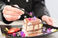 The chef prepares a dessert.