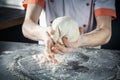 Chef prepares the dough with flour. Hands kneading raw dough Horizontal. Copy space. Gluten free dough for pasta, bakery or pizza Royalty Free Stock Photo