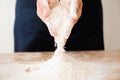 The chef prepares the dough - the process of making dough in the kitchen Royalty Free Stock Photo
