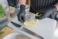 The chef prepares a flatbread with herbs. Royalty Free Stock Photo