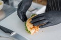 The chef prepares a flatbread with herbs. Royalty Free Stock Photo