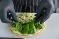 The chef prepares a flatbread with herbs. Royalty Free Stock Photo
