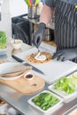 The chef prepares a flatbread with herbs. Royalty Free Stock Photo