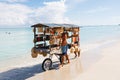 Chef prepares a giant seafood paella on beach Varadero near sunbathing tourists