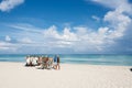 Chef prepares a giant seafood paella on beach Varadero near sunbathing tourists