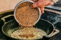 Chef prepares ingredients for bulgur on the grill