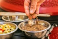 Chef prepares ingredients for bulgur on the grill