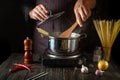 The chef prepares organic pasta in a hot pot in the kitchen. Delicious hotel food recipe. Traditional Italian cuisine