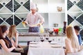 The chef prepares the paste for the visitors. Royalty Free Stock Photo