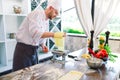 The chef prepares the paste for the visitors. Royalty Free Stock Photo