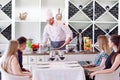 The chef prepares the paste for the visitors. Royalty Free Stock Photo