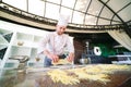 The chef prepares the paste for the visitors. Royalty Free Stock Photo