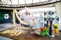 The chef prepares the paste for the visitors. Royalty Free Stock Photo