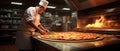 Chef Prepares Pizza In A Restaurant Kitchen