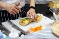 Chef prepares sandwich in the kitchen, Delicious sandwich with veggies and meat