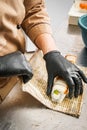 Chef prepares sushi roll in a professional kitchen Royalty Free Stock Photo