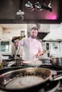 Chef preparing beef fillet steak in a frying pan