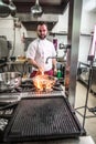 Chef preparing beef fillet steak in a frying pan