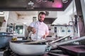 Chef preparing beef fillet steak in a frying pan