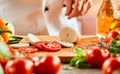 Chef preparing a Caprese salad Royalty Free Stock Photo