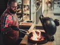 Chef preparing charcoals before grilling in a restaurant Royalty Free Stock Photo