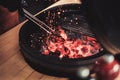 Chef preparing charcoals before grilling in a restaurant Royalty Free Stock Photo