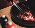 Chef preparing charcoals before grilling in a restaurant Royalty Free Stock Photo