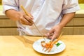 Chef cooking lobster sashimi