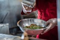 Chef preparing cooking and serving indian cuisine dish