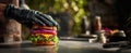 The chef preparing a delicious gourmet burger with fresh ingredients. AI generated image Royalty Free Stock Photo