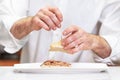 Chef preparing delicious typical Spanish food, tuna tapa or Pintxo of tuna.