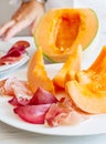 Chef preparing dish with melon and ham Royalty Free Stock Photo