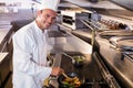 Chef preparing food in the kitchen Royalty Free Stock Photo