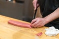 Chef preparing a fresh Tuna on a cutting board for otoro sushi Royalty Free Stock Photo