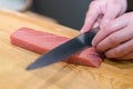 Chef preparing a fresh Tuna on a cutting board for otoro sushi Royalty Free Stock Photo