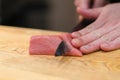 Chef preparing a fresh Tuna on a cutting board for otoro sushi Royalty Free Stock Photo