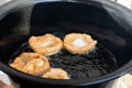 Chef preparing fried churros or donuts and pancakes during brunch buffet in the garden. Food Buffet Brunch Catering Dining Eating