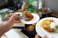 Chef preparing fried potato pancakes in frying pan closeup Royalty Free Stock Photo