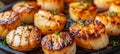 Chef preparing grilled scallops in creamy butter lemon or cajun sauce with herbs