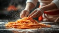 Chef preparing pasta, flour dusting, kitchen background, food photography Royalty Free Stock Photo