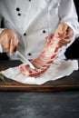 Chef preparing raw lamb chops for cooking Royalty Free Stock Photo